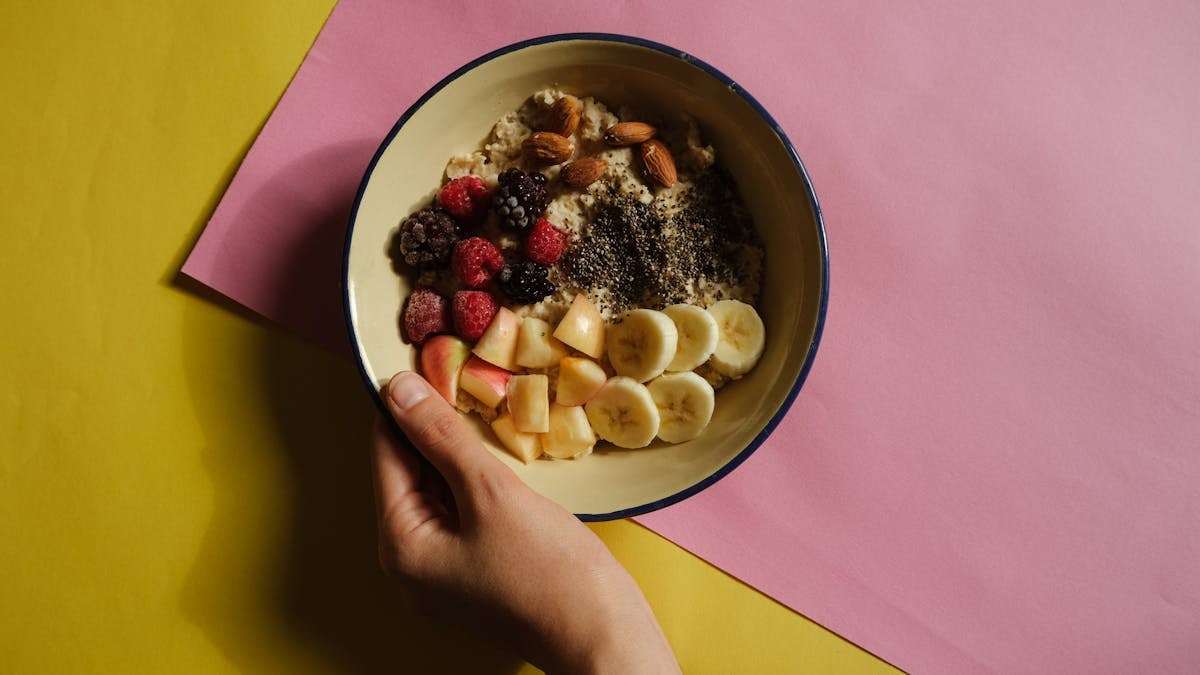 Delicious oatmeal bowl with fresh fruits and nuts, perfect for a healthy breakfast.